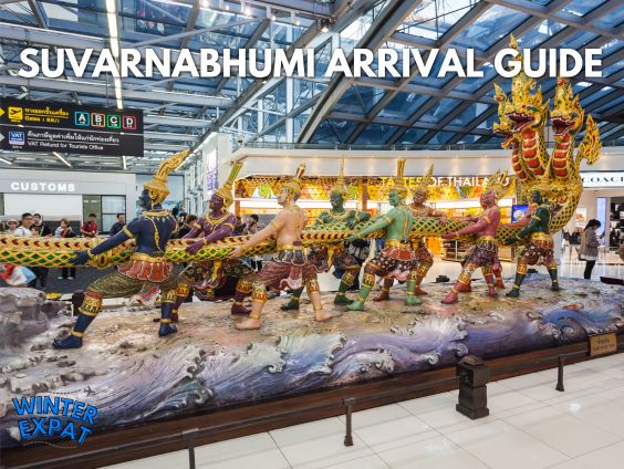 A wide graphic showing the large, colorful "Churning of the Milk Ocean" statue inside Suvarnabhumi Airport in Bangkok. Multiple traditional Thai figures pull a giant naga serpent. Large text overlay reads "SUVARNABHUMI ARRIVAL GUIDE" across the top, with a WinterExpat logo in the bottom left corner. Original photo by Ariana of WinterExpat.